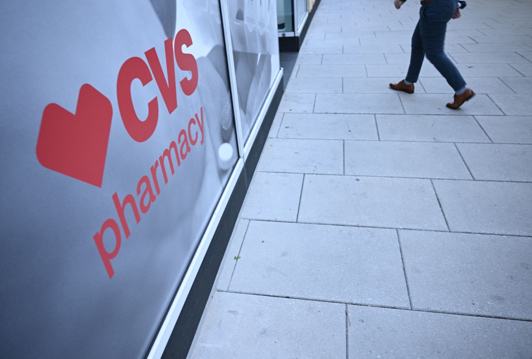 Customer walking into a CVS location. (BRENDAN SMIALOWSKI/AFP via Getty Images)