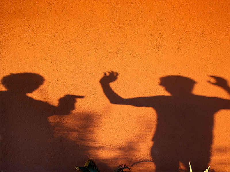 Two humans in a gun fight