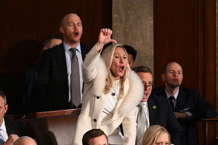US Representative Marjorie Taylor Greene (R-GA) and Republican members of Congress react as US President Joe Biden delivers the State of the Union address in the House Chamber of the US Capitol in Washington, DC, on February 7, 2023. (JIM WATSON/AFP via Getty Images)