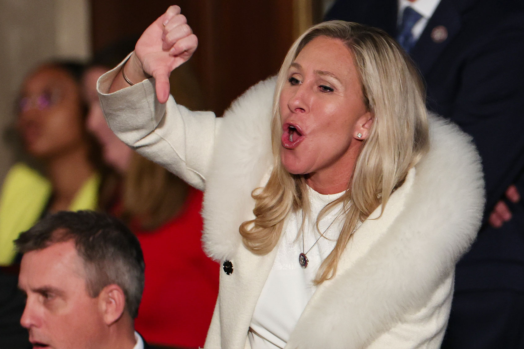 U.S. Rep. Marjorie Taylor Greene (R-GA) gives a thumbs down during President Joe Biden's State of the Union address during a joint meeting of Congress in the House Chamber of the U.S. Capitol on February 07, 2023 in Washington, DC. (Win McNamee/Getty Images)
