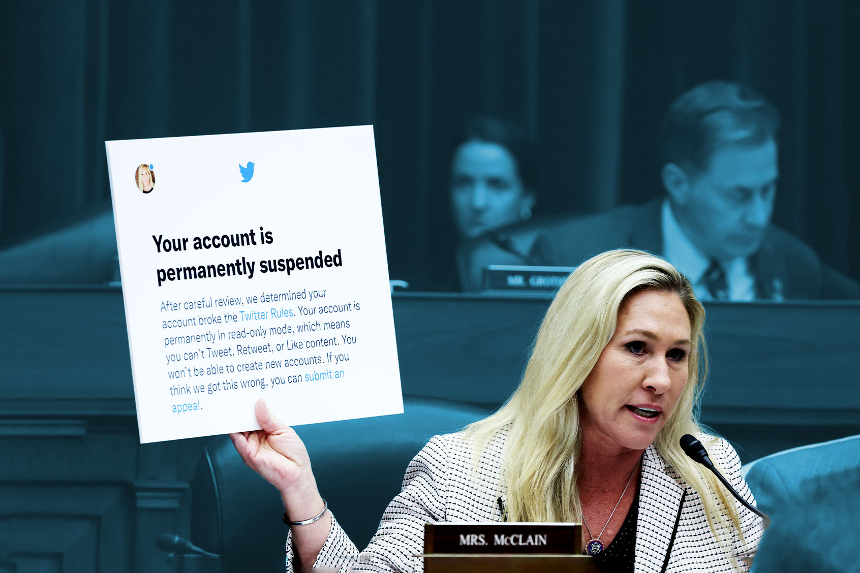 U.S. Rep. Marjorie Taylor-Greene (R-GA) holds up a poster of a Twitter announcement of suspending her account during a hearing before the House Oversight and Accountability Committee at Rayburn House Office Building on Capitol Hill on February 8, 2023 in Washington, DC. (Alex Wong/Getty Images)