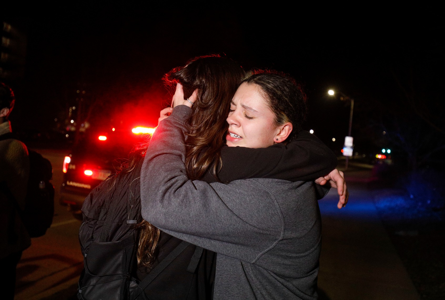 Michigan State University students hug during an active shooter situation on campus on February 13, 2023 in Lansing, Michigan. (Bill Pugliano/Getty Images)