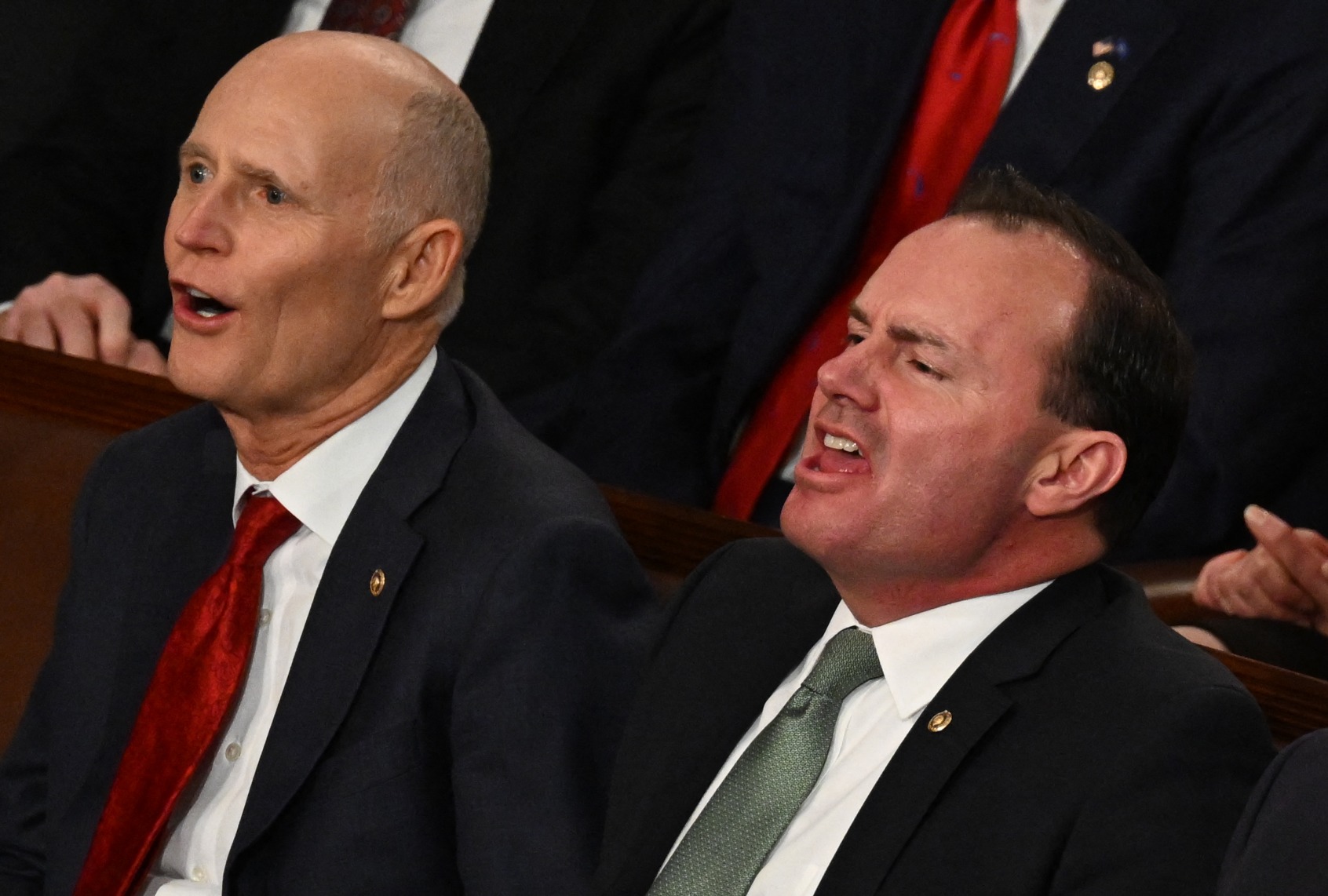 Senators Rick Scott (R-FL) and Mike Lee (R-UT) yell as President Joe Biden delivers the State of the Union address at the US Capitol in Washington, DC, February 7, 2023. (ANDREW CABALLERO-REYNOLDS/AFP via Getty Images)