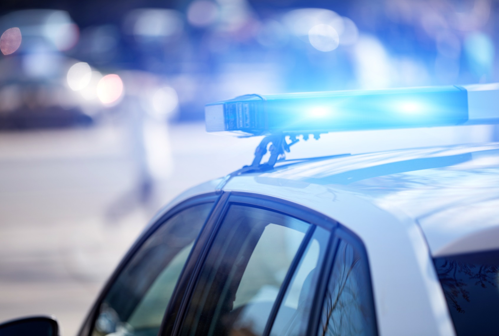 Police car with blue lights. (m-gucci/Getty Images)