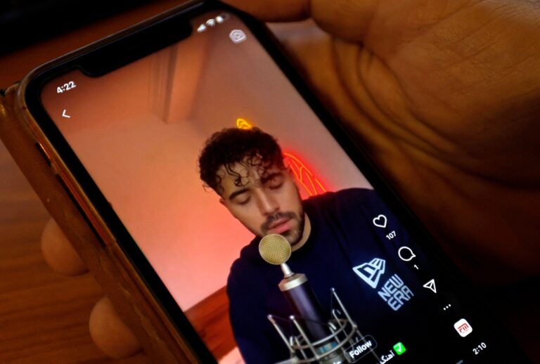 A man watches a video of Iranian singer Shervin Hajipour, who was released in Tehran today after being arrested for his song in support of protests over the death of Mahsa Amini, in the Cypriot capital Nicosia on October 4, 2022 (KHALED DESOUKI/AFP via Getty Images)