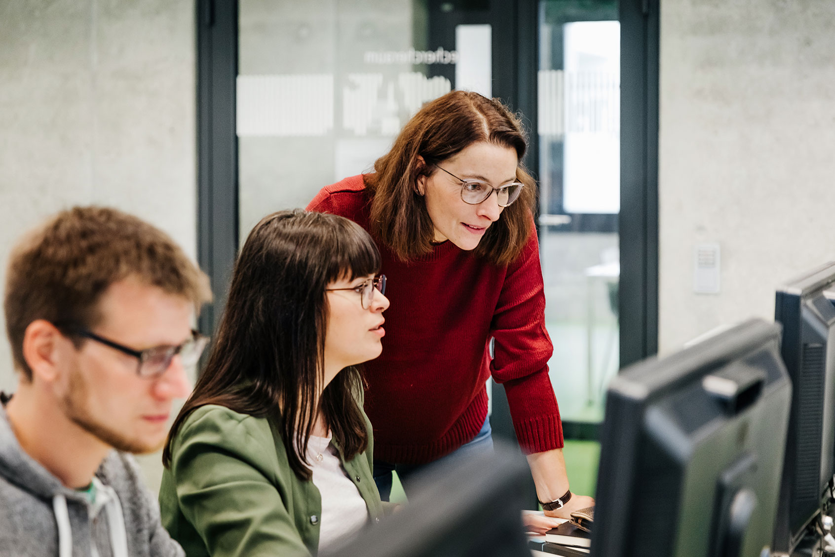 Teacher Helping Student With Computer Work (Getty Images/Tom Werner)