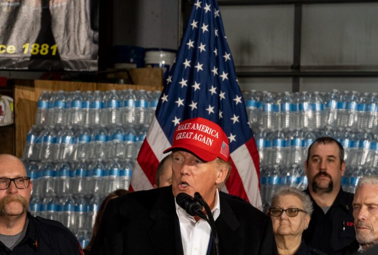 Former President Donald Trump stands next to a pallet of water before delivering remarks at the East Palestine Fire Department station on February 22, 2023 in East Palestine, Ohio. (Michael Swensen/Getty Images)