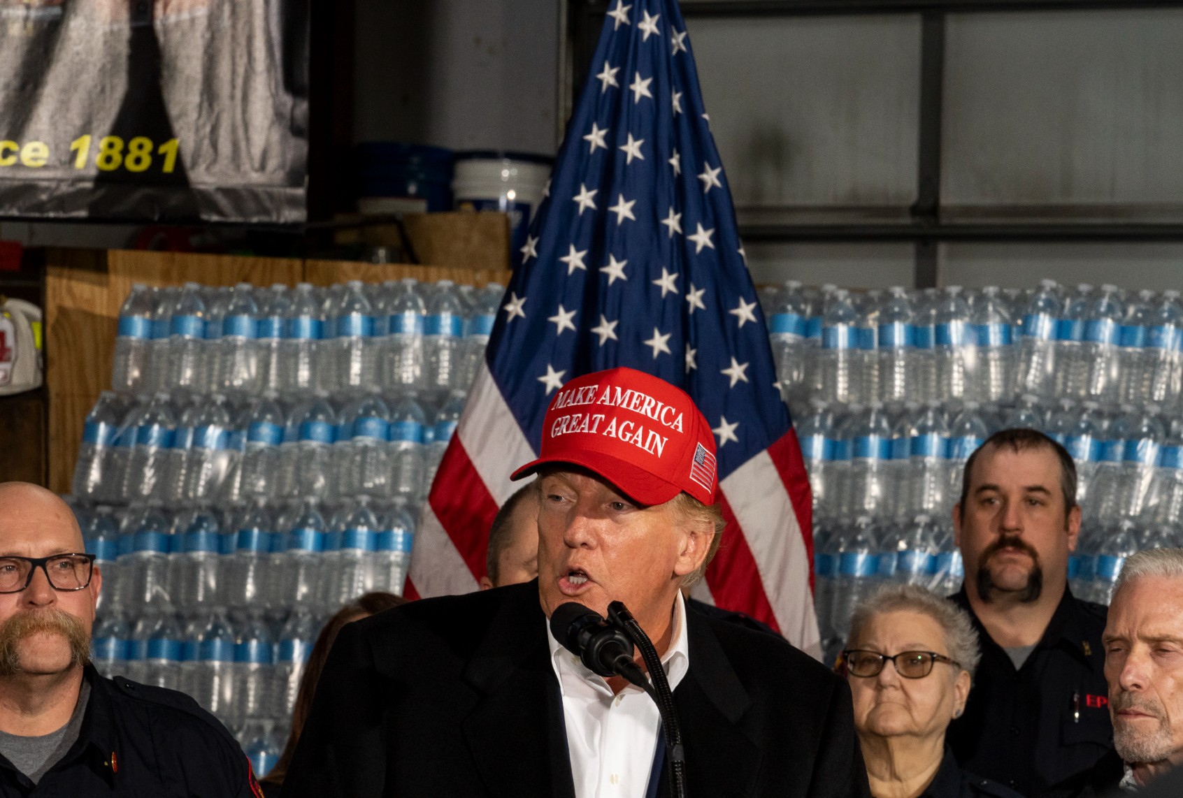 Former President Donald Trump stands next to a pallet of water before delivering remarks at the East Palestine Fire Department station on February 22, 2023 in East Palestine, Ohio. (Michael Swensen/Getty Images)