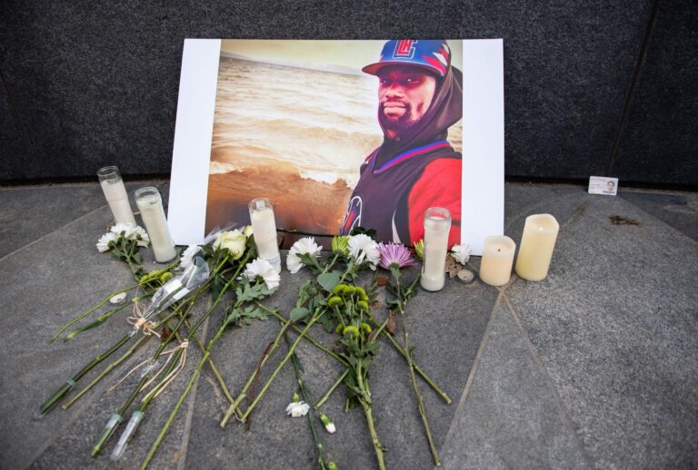 A memorial is displayed for Tyre Nichols at the Embrace statue in Boston, Massachusetts, on January 28, 2023. (JOSEPH PREZIOSO/AFP via Getty Images)
