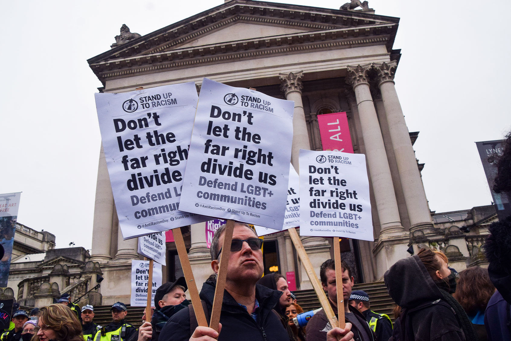A pro-LGBTQ rights protester holds anti-far-right placards during the demonstration. (Vuk Valcic/SOPA Images/LightRocket via Getty Images)