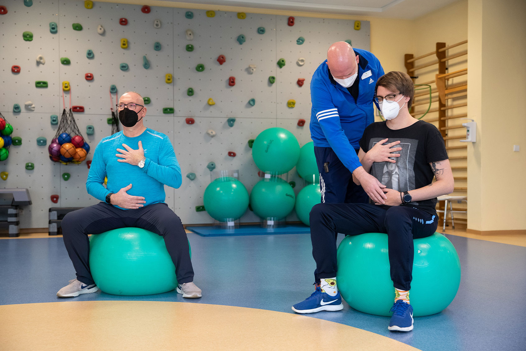 Long-covid patients do breathing training with a physiotherapist in a gymnastics room at the Teutoburger Wald Clinic, a rehabilitation clinic for post-covid patients. (Friso Gentsch/picture alliance via Getty Images)
