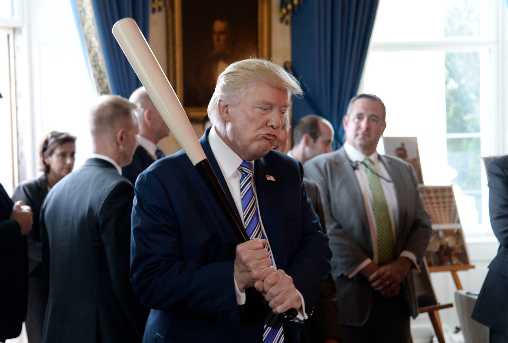 Former President Donald Trump holds a Marucci baseball bat in the Blue Room during a "Made in America" product showcase event at the White House in Washington, DC, on July 17, 2017. (OLIVIER DOULIERY/AFP via Getty Images)