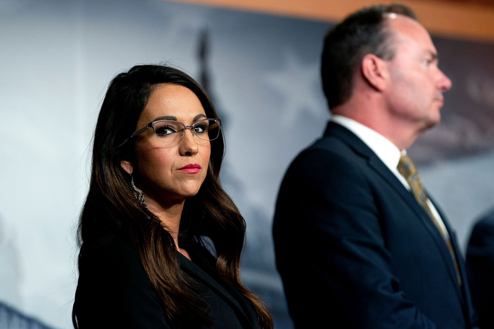 US Representative Lauren Boebert (R-CO) (L) listens alongside members of the House Freedom Caucus during a news conference on the debt limit at the US Capitol in Washington, DC, on March 22, 2023. (STEFANI REYNOLDS/AFP via Getty Images)