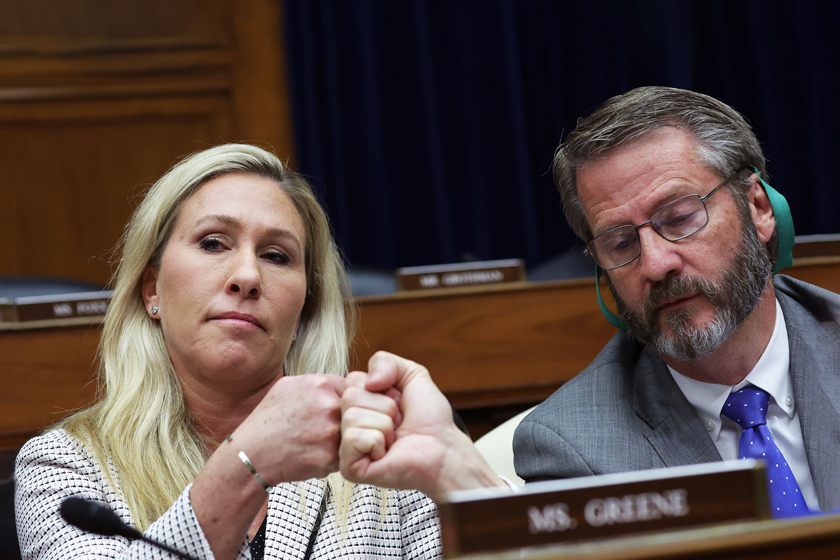 U.S. Rep. Marjorie Taylor-Greene (R-GA) (L) fist-bumps Rep. Tim Burchett (R-TN) (R) during a hearing before the House Oversight and Accountability Committee at Rayburn House Office Building on Capitol Hill on February 8, 2023 in Washington, DC. (Alex Wong/Getty Images)