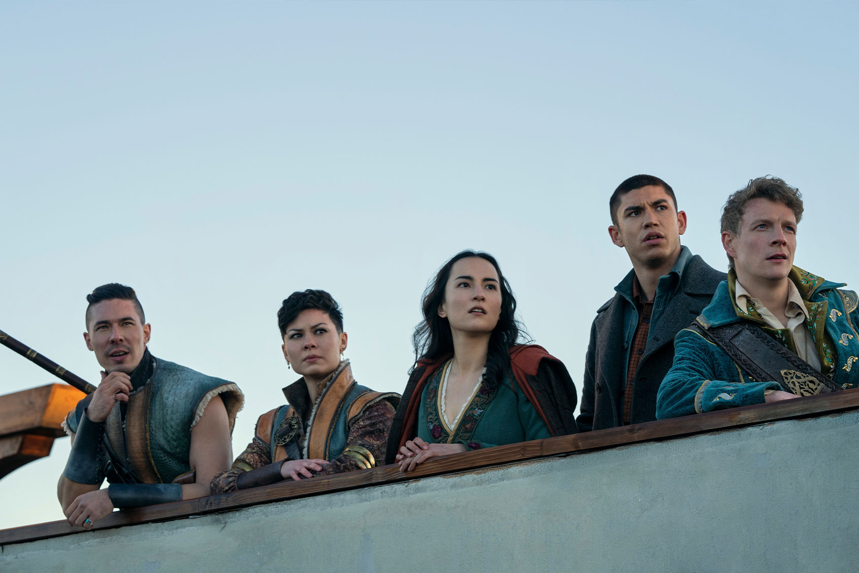 Lewis Tan as Tolya, Anna Leong Brophy as Tamar, Jessie Mei Li as Alina Starkov, Archie Renaux as Malyen Oretsev, and Patrick Gibson as Nikolai in "Shadow and Bone." (Dávid Lukács/Netflix)