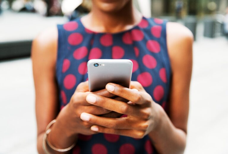 Woman using phone. (Tim Robberts/Getty Images)