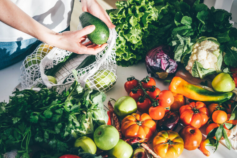 Woman takes fresh organic vegetables (Getty Images/Maria Korneeva)