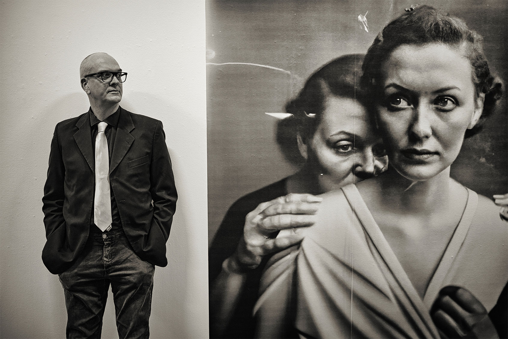 Boris Eldagsen next to the AI-created piece, "Pseudomnesia: The Electrician" (Alex Schwander)