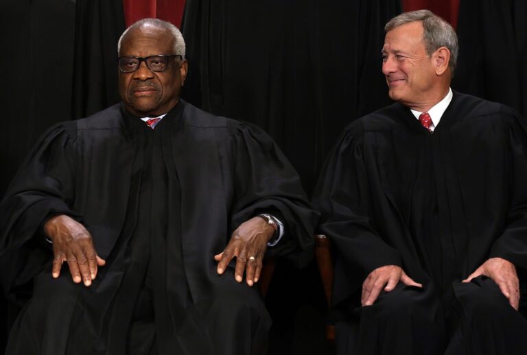 United States Supreme Court Associate Justice Clarence Thomas (L) and Chief Justice of the United States John Roberts (R) on October 7, 2022 in Washington, DC. (Alex Wong/Getty Images)