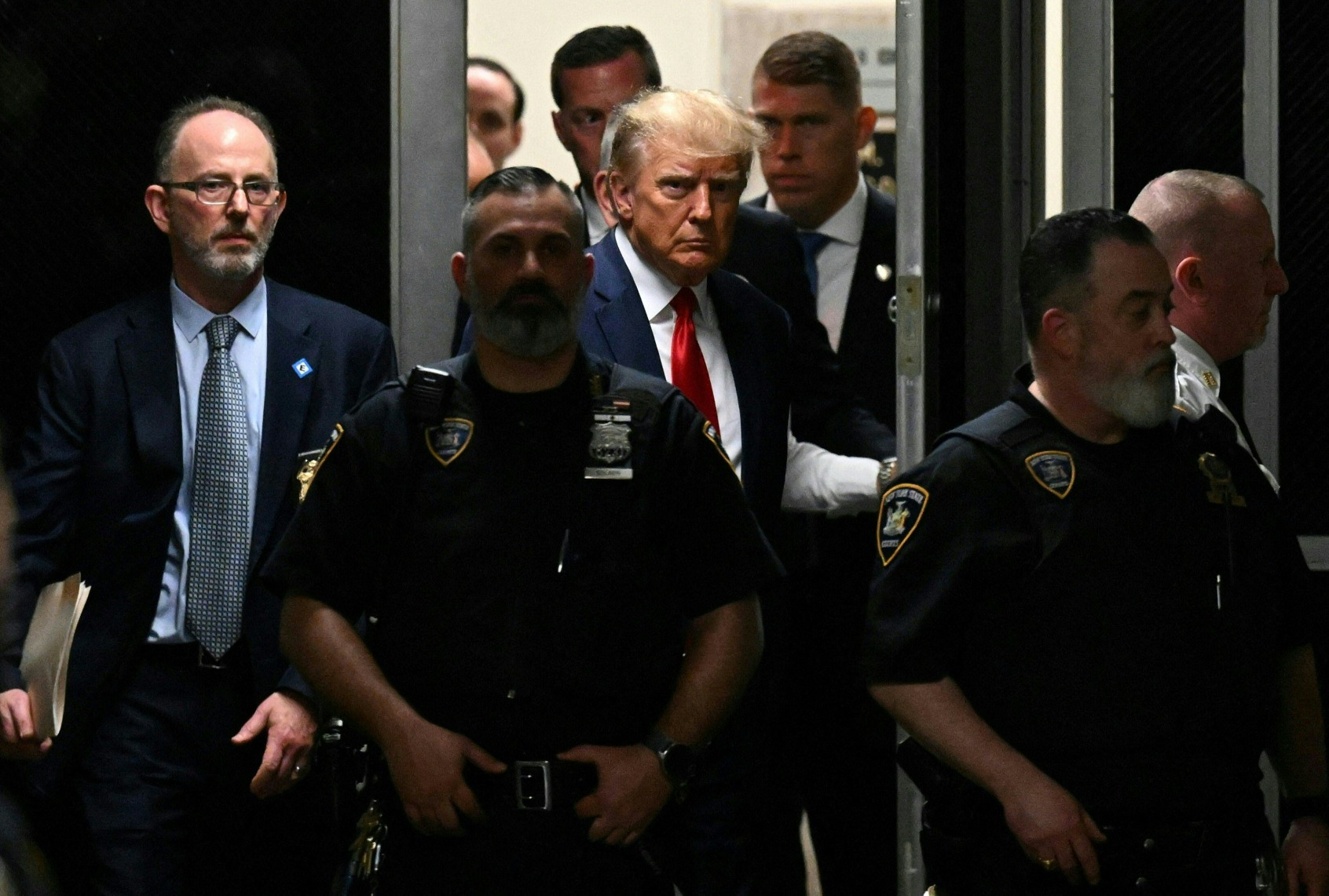 Former President Donald Trump makes his way inside the Manhattan Criminal Courthouse in New York on April 4, 2023. (ED JONES/AFP via Getty Images)