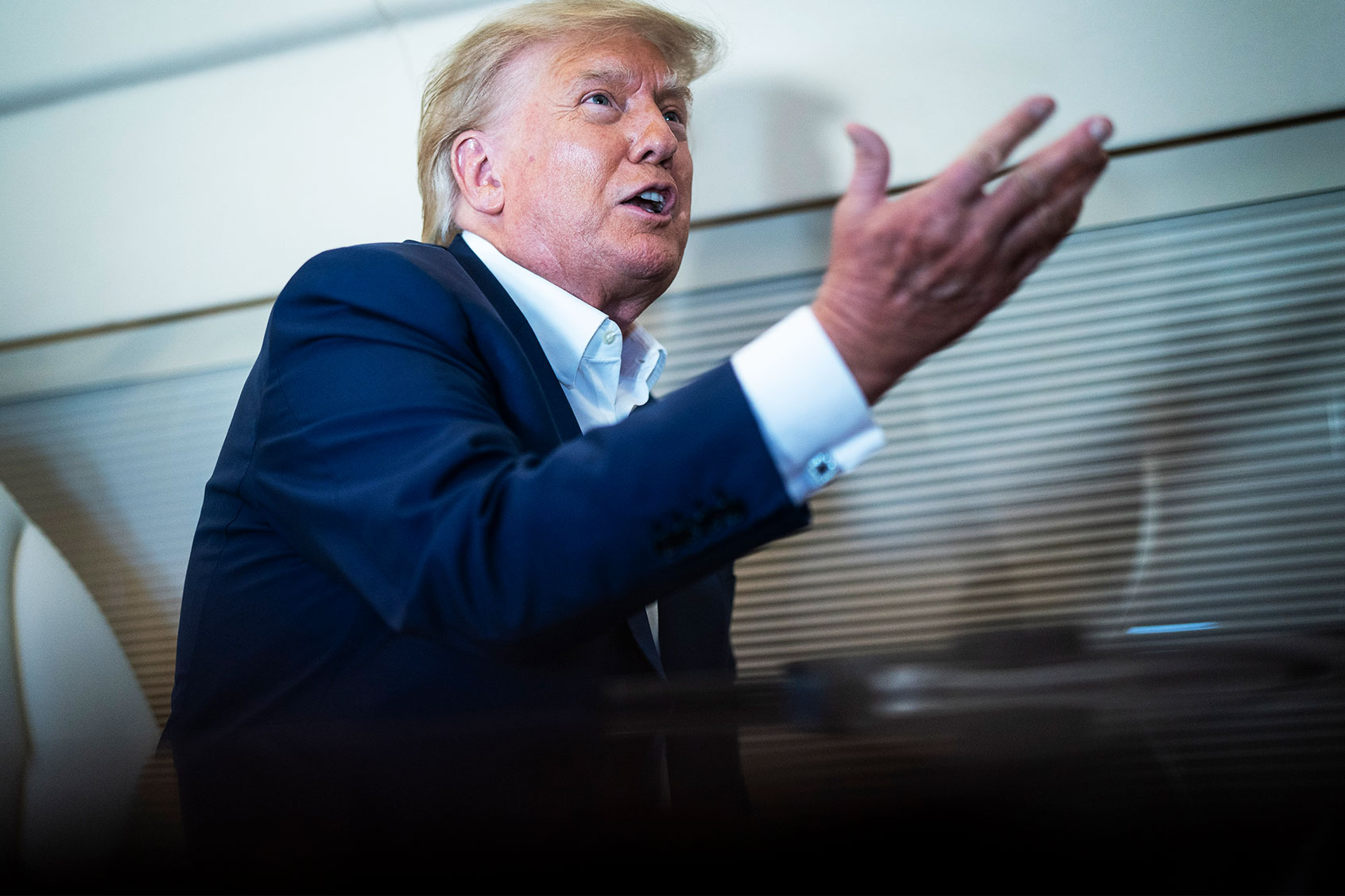 Former President Donald Trump speaks with reporters and staff on his airplane, known as Trump Force One, as he is flown to Iowa on Monday, March 13, 2023, in West Palm Beach, FL. (Jabin Botsford/The Washington Post via Getty Images)