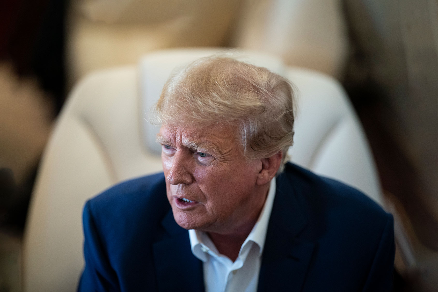 Former President Donald Trump speaks with reporters and staff on his airplane, known as Trump Force One, as he is flown to Iowa on Monday, March 13, 2023, in West Palm Beach, FL. (Jabin Botsford/The Washington Post via Getty Images)