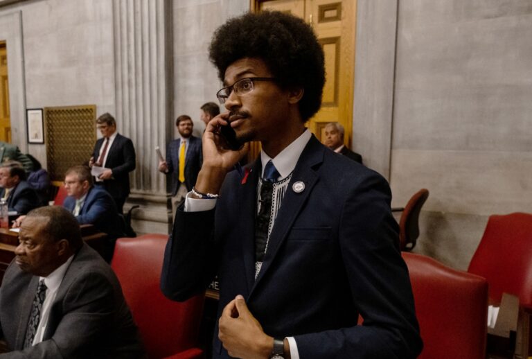 Democratic state Rep. Justin Pearson of Memphis speaks on his phone while being expelled from the state Legislature on April 6, 2023 in Nashville, Tennessee. (Seth Herald/Getty Images)