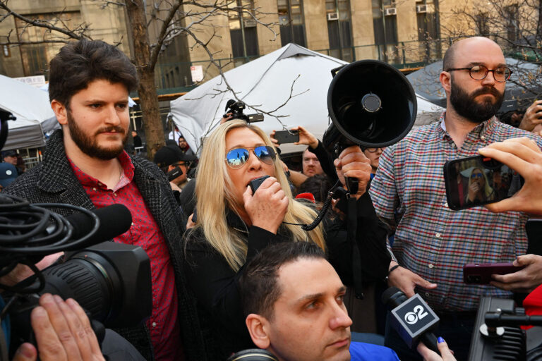 Rep. Marjorie Taylor Green (R-GA) talks to supporters of former US President Donald Trump outside the District Attorneys office in New York on April 4, 2023. (ANGELA WEISS/AFP via Getty Images)