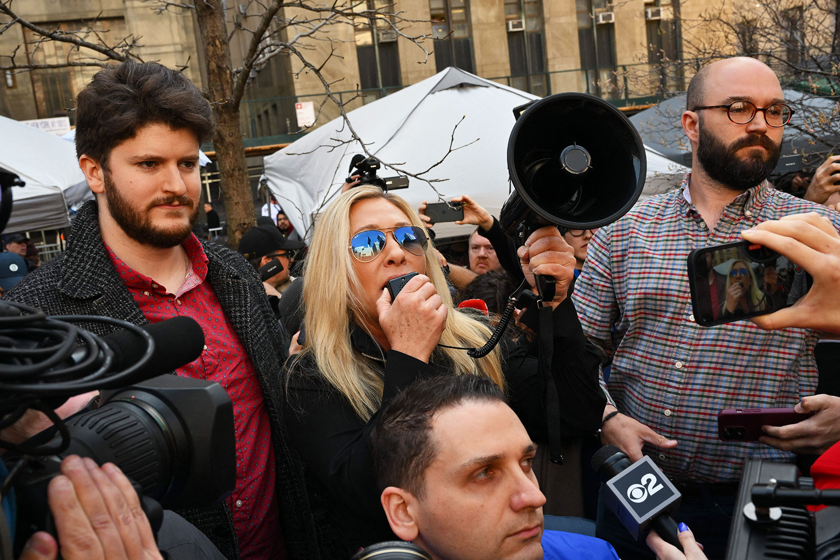 Rep. Marjorie Taylor Green (R-GA) talks to supporters of former US President Donald Trump outside the District Attorneys office in New York on April 4, 2023. (ANGELA WEISS/AFP via Getty Images)