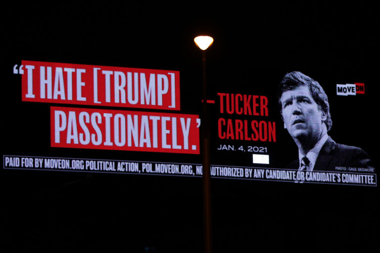 A billboard put up by progressive activist group MoveOn that read “I Hate [Trump] Passionately - Tucker Carlson” is seen along I-95 on April 3, 2023 in West Palm Beach, Florida. (Alex Wong/Getty Images)