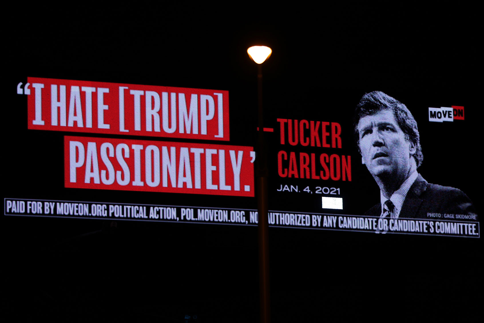 A billboard put up by progressive activist group MoveOn that read “I Hate [Trump] Passionately - Tucker Carlson” is seen along I-95 on April 3, 2023 in West Palm Beach, Florida. (Alex Wong/Getty Images)