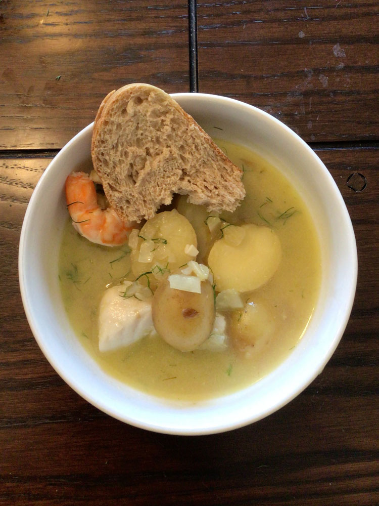 Bowl of fish stew with bread