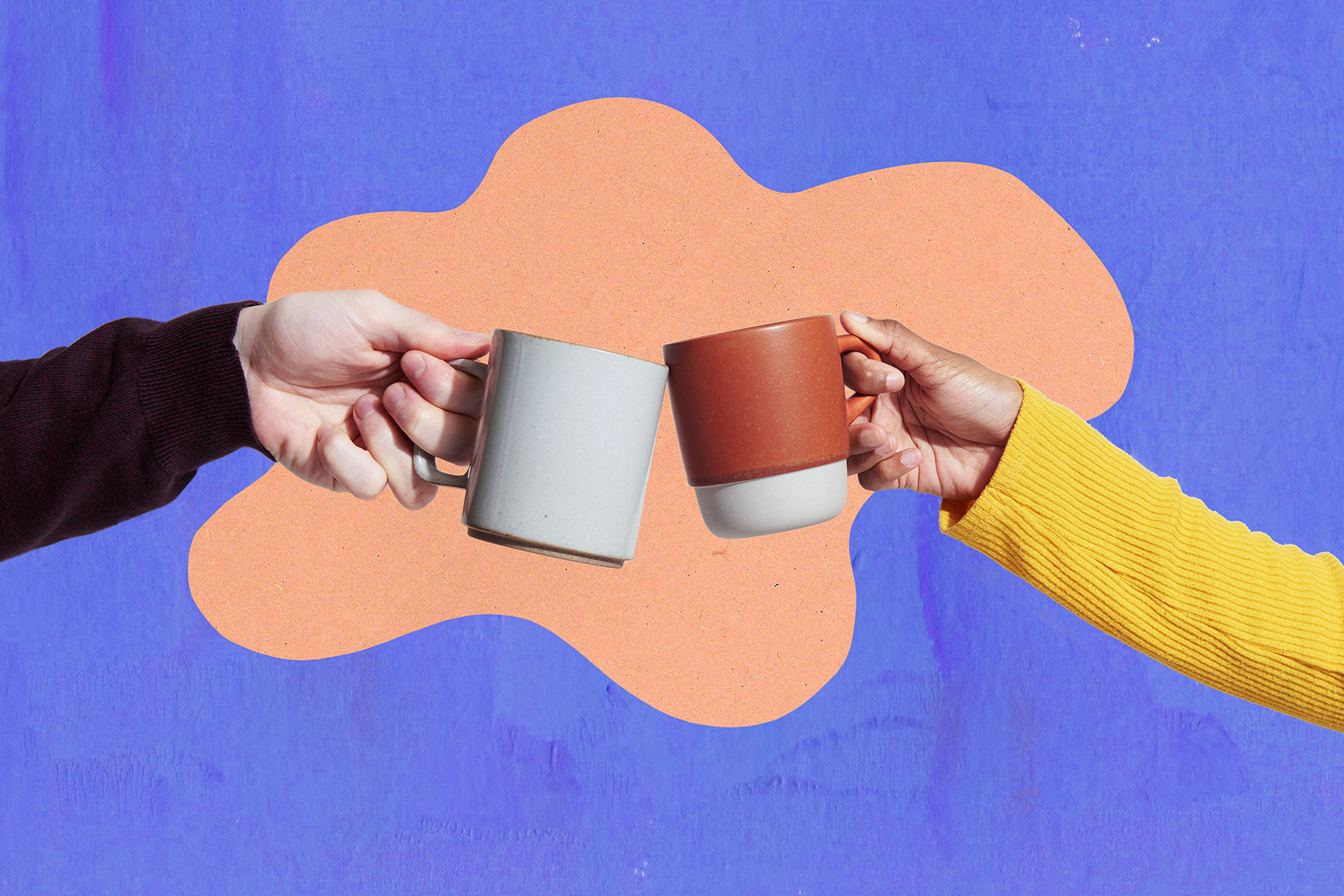 Clinking two coffee mugs (Getty Images/We Are)