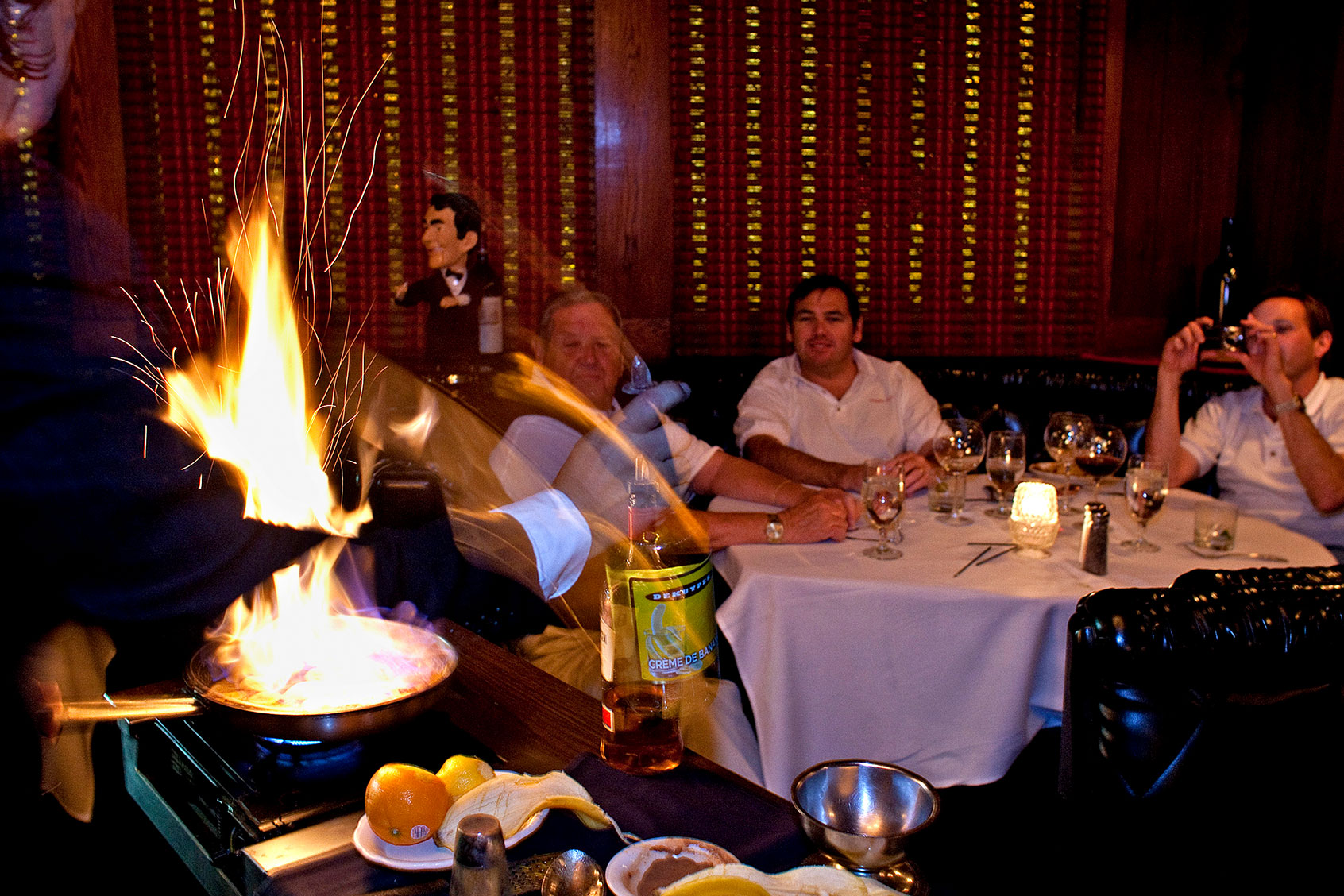 The Wood family from Corona Del Mar gets treated to a flaming table side Bananas Foster desert at the Golden Steer restaurant. The restaurant opened in 1958.