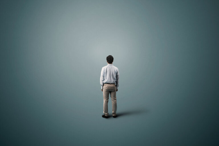 Man standing alone in space (Getty Images/Yagi Studio)