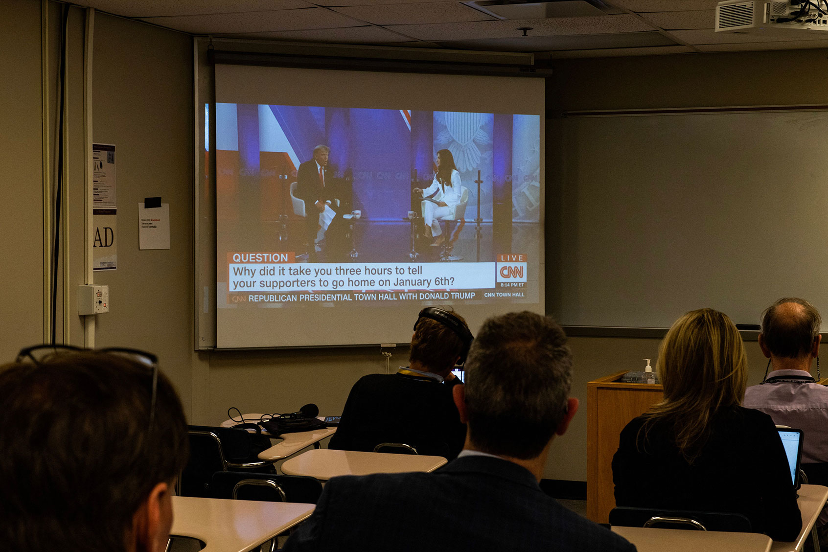 Reporters watch a CNN town hall with former US President and 2024 Presidential hopeful Donald Trump at St. Anselm College in Manchester, New Hampshire, on May 10, 2023. (JOSEPH PREZIOSO/AFP via Getty Images)