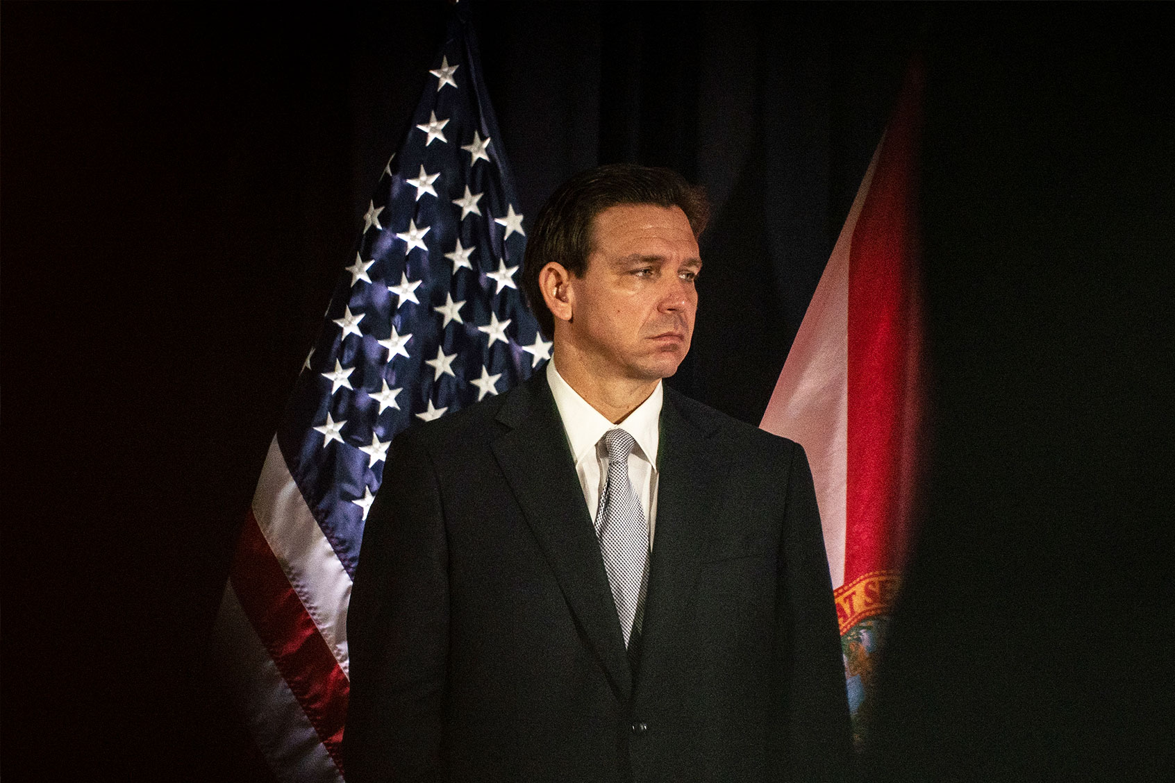 Florida Gov. Ron DeSantis listens to other speakers before signing a series of education bills at Cambridge Christian school in Tampa, Fla. on Wednesday, May 17, 2023. (Thomas Simonetti for The Washington Post via Getty Images)
