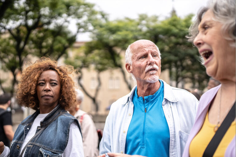 Senior woman screaming and her friends looking surprised (Getty Images/FG Trade)