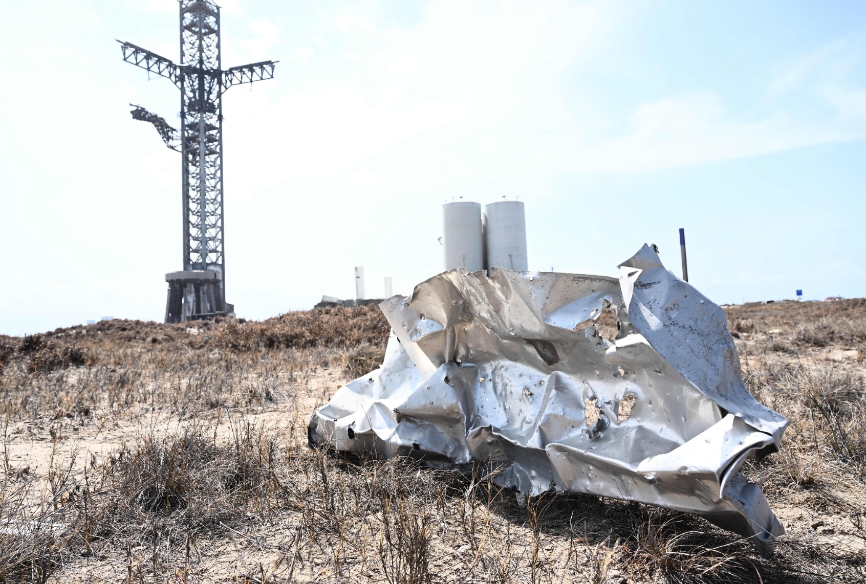 Debris litters the ground on April 22, 2023, after the SpaceX Starship lifted off on April 20 for a flight test from Starbase in Boca Chica, Texas. - The rocket successfully blasted and the Starship capsule had been scheduled to separate from the first-stage rocket booster three minutes into the flight but separation failed to occur and the rocket blew up. (PATRICK T. FALLON/AFP via Getty Images)