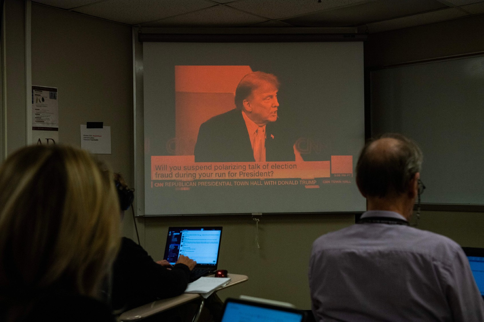 Reporters watch a CNN town hall with former US President and 2024 Presidential hopeful Donald Trump at St. Anselm College in Manchester, New Hampshire, on May 10, 2023. (JOSEPH PREZIOSO/AFP via Getty Images)
