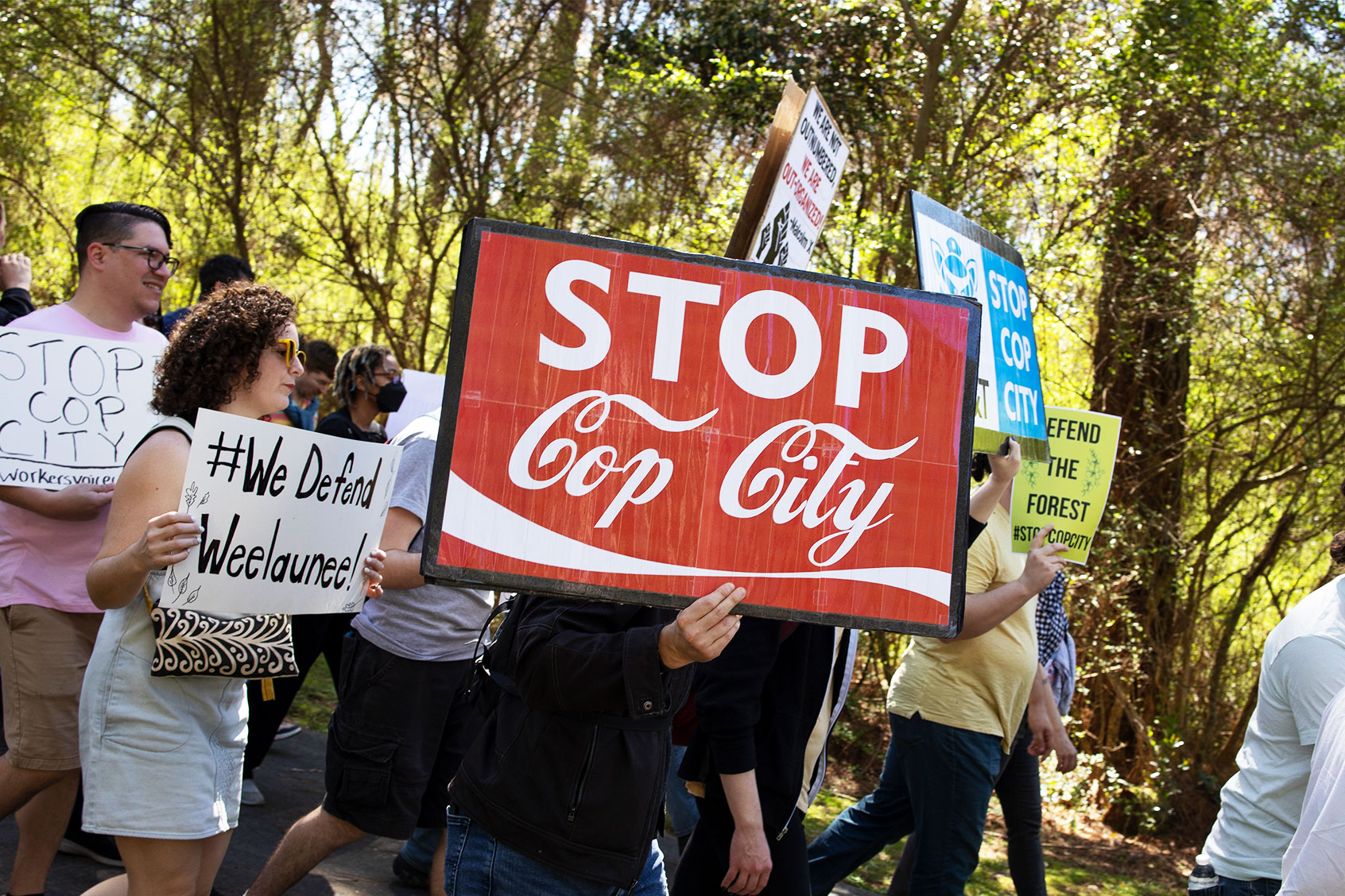 Environmental activists hold a rally and a march through the Atlanta Forest, a preserved forest Atlanta that is scheduled to be developed as a police training center, March 4, 2023 in Atlanta, Georgia. (Andrew Lichtenstein/Corbis via Getty Images)