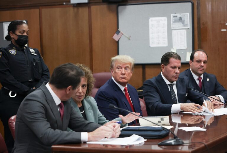 Former President Donald Trump sits in the courtroom with his attorneys (L-R) Todd Blanche, Susan Necheles, Joe Tacopina and Boris Epshteyn during his arraignment at the Manhattan Criminal Court April 4, 2023 in New York City. (Andrew Kelly-Pool/Getty Images)