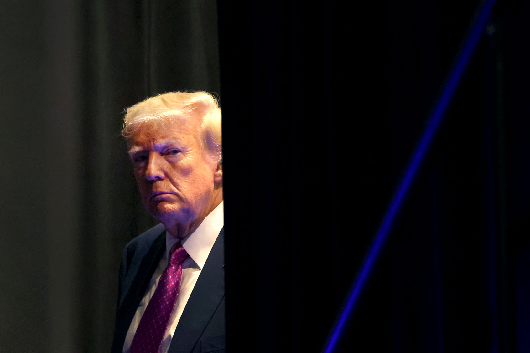Former U.S. President Donald Trump waits to be introduced at the Oakland County Republican Party's Lincoln Day dinner at Suburban Collection Showplace on June 25, 2023 in Novi, Michigan. (Scott Olson/Getty Images)
