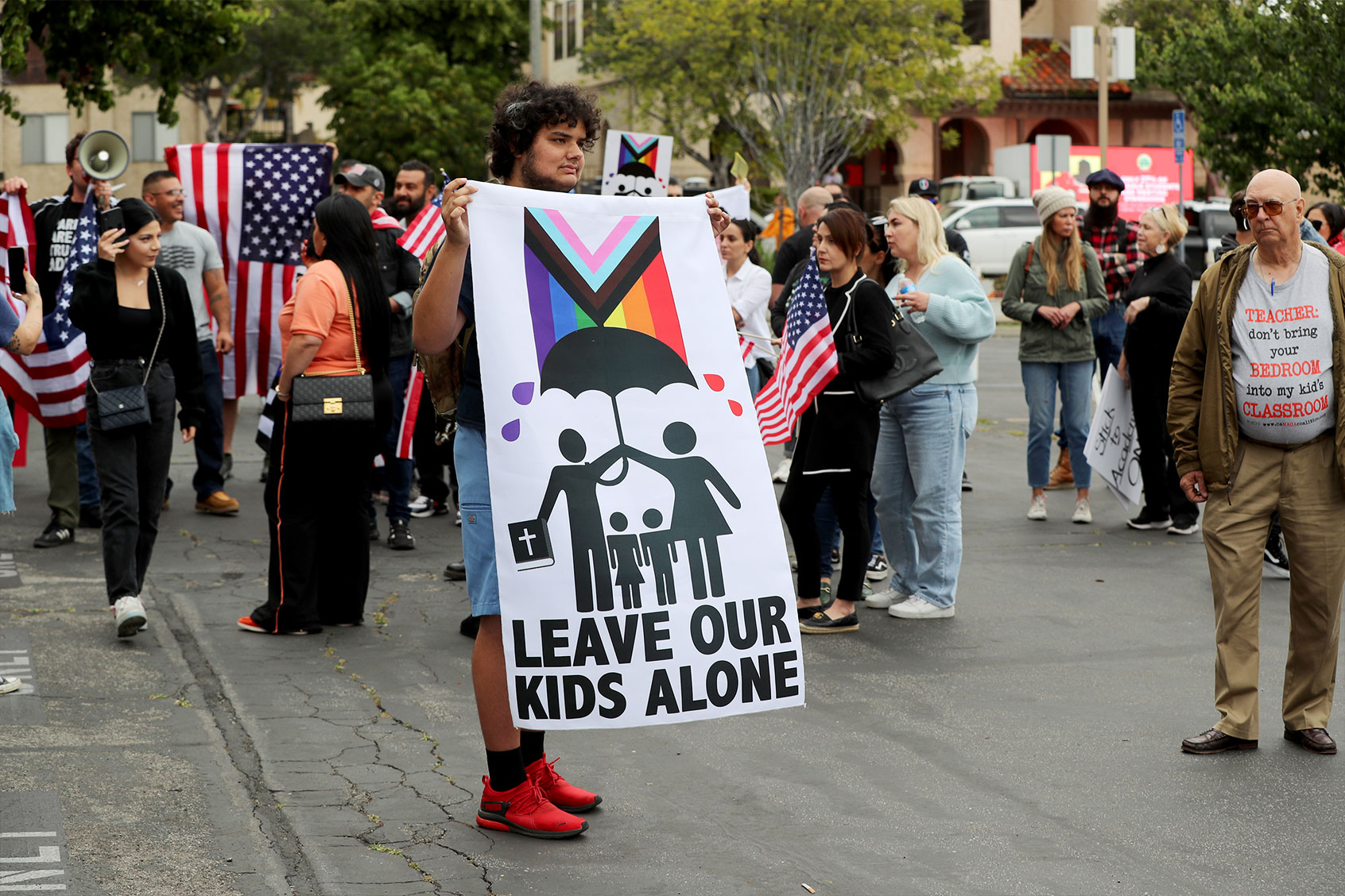 Protestors makie their opinions known and join crowds gathering outside a Glendale Unified School District meeting where parents and activists differ over teaching sexual identity to kids at Glendale Unified School District in Burbank Tuesday, June 6, 2023. (Allen J. Schaben / Los Angeles Times via Getty Images)
