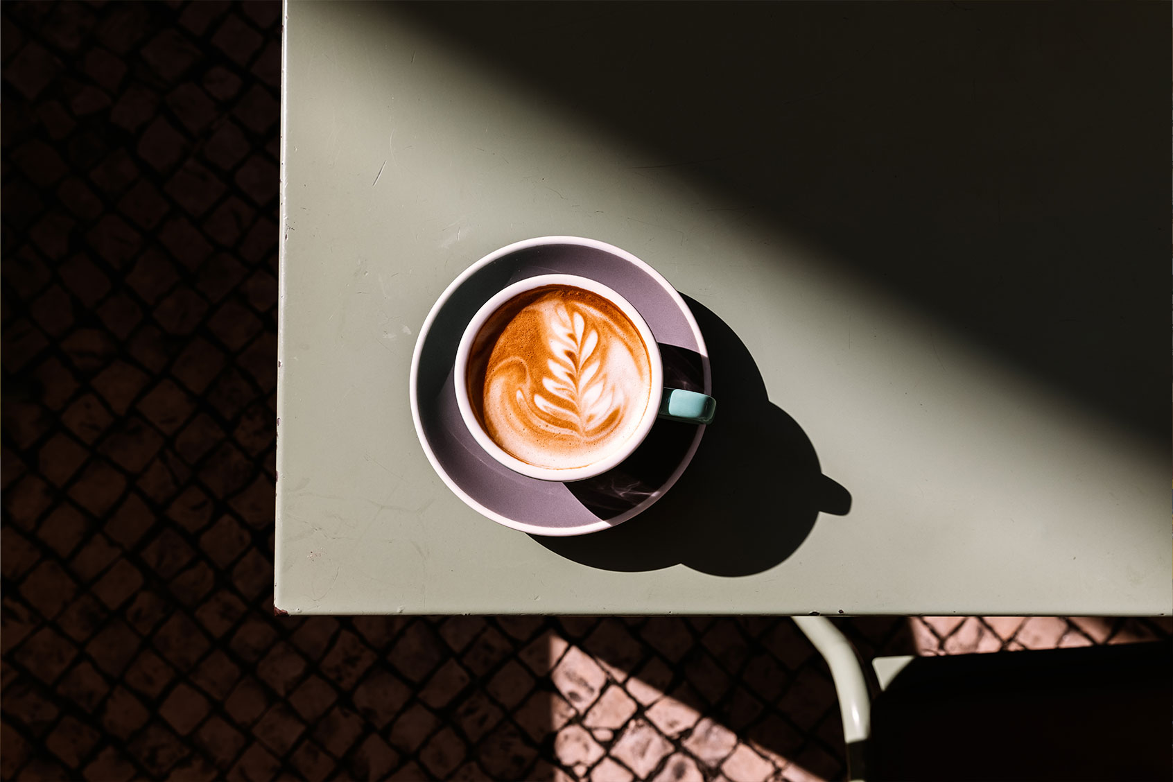 Cappuccino with latte art on the table (Getty Images/Alexander Spatari)