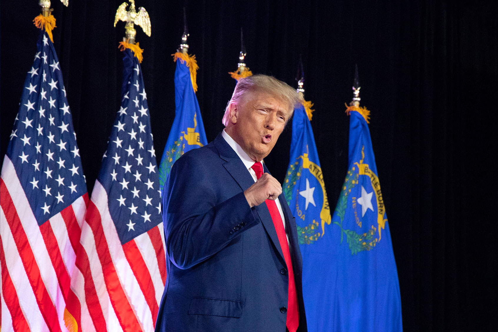 President Donald Trump pumps his fist after taking the stage prior to speaking at a Nevada Volunteer Recruitment Event at Fervent Calvary Chapel Church Saturday, July 8, 2023, in Las Vegas. (Ronda Churchill for The Washington Post via Getty Images)