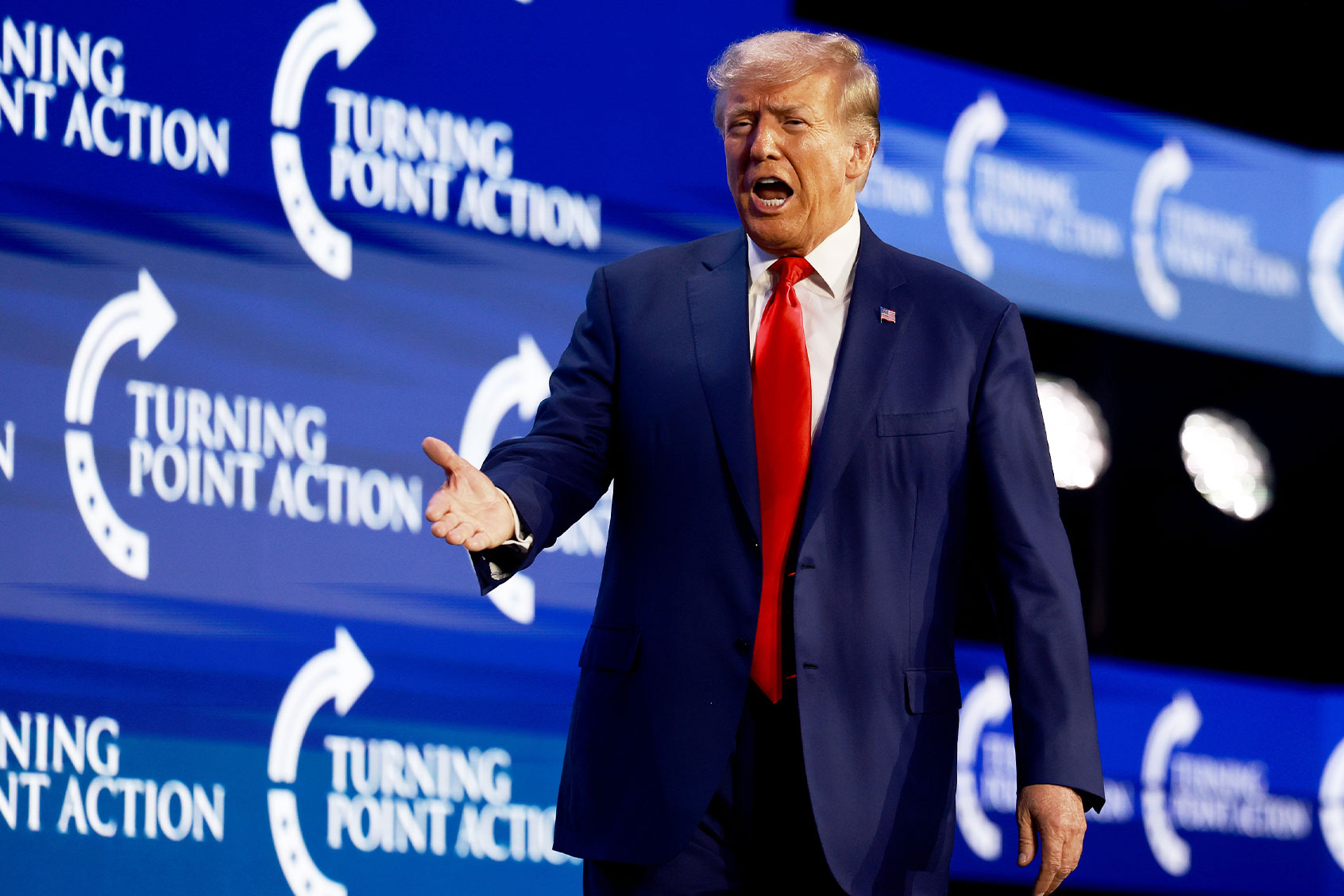 Former US President Donald Trump arrives on stage to speak at the Turning Point Action conference as he continues his 2024 presidential campaign on July 15, 2023 in West Palm Beach, Florida. (Joe Raedle/Getty Images)