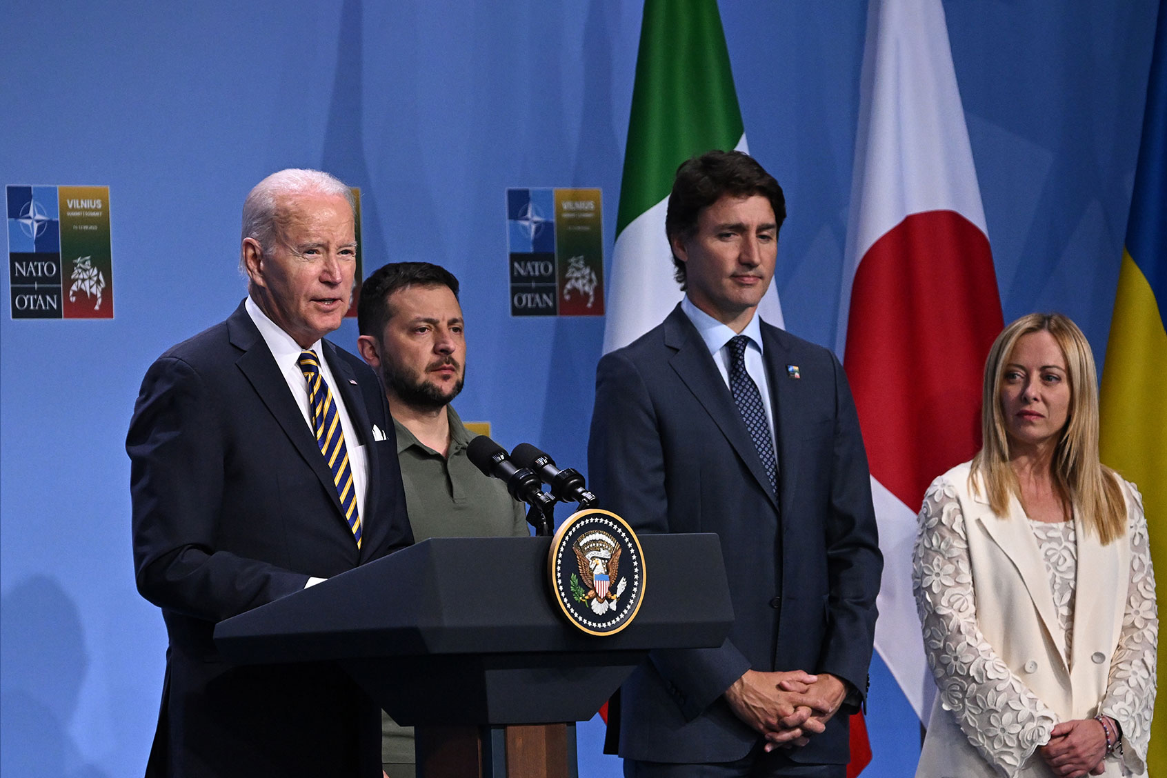 US President Joe Biden speaks alongside Ukrainian President Volodymyr Zelenskyy, Canada's Prime Minister Justin Trudeau and Italy's Prime Minister Giorgia Meloni during a G7 declaration of joint support for Ukraine on July 12, 2023 in Vilnius, Lithuania. (Paul Ellis - Pool/Getty Images)