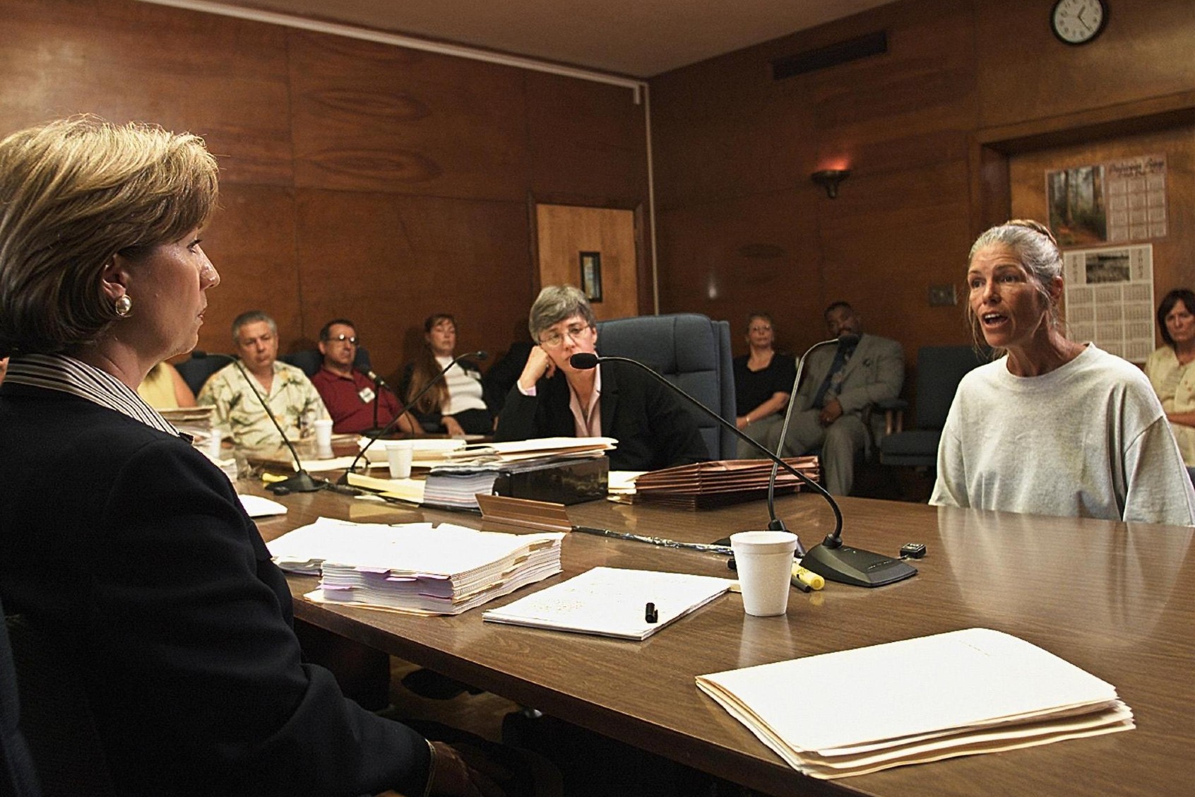 Sheron Lawin (L), a member of the Board of Prison Terms commissioners, listens to Leslie Van Houten (R), after her parole was denied June 28, 2002 at the California Institution for Women in Corona, California. (DAMIAN DOVARGANES/AFP via Getty Images)