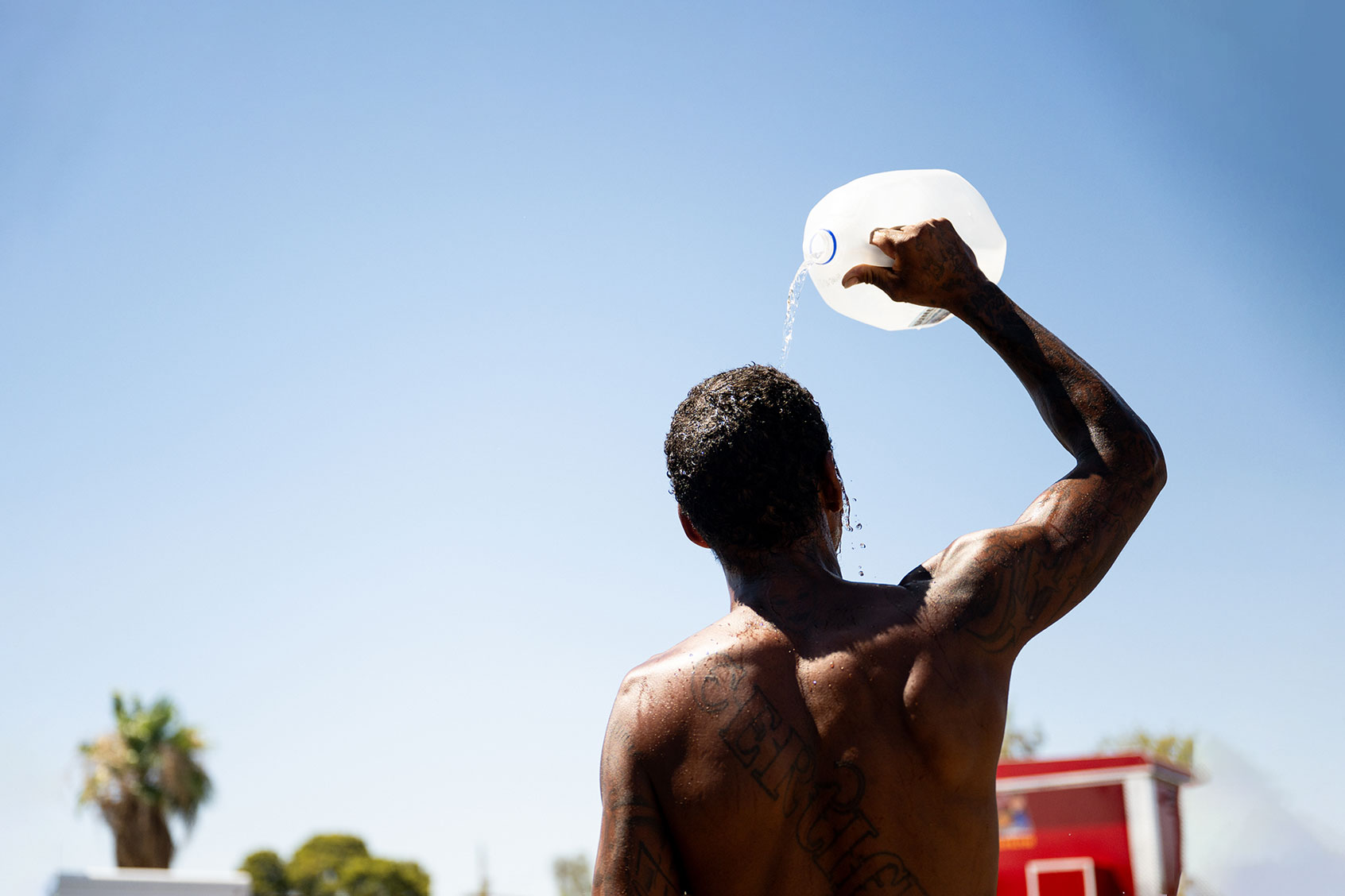 A person cools off amid searing heat that was forecast to reach 115 degrees Fahrenheit on July 16, 2023 in Phoenix, Arizona. (Brandon Bell/Getty Images)